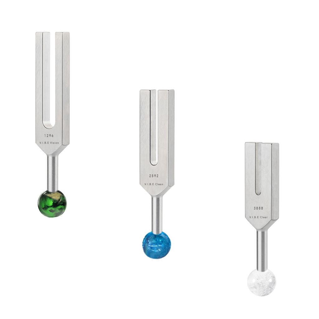 3 Tuning forks with colorful crystals on the bottom of the tuning forks
